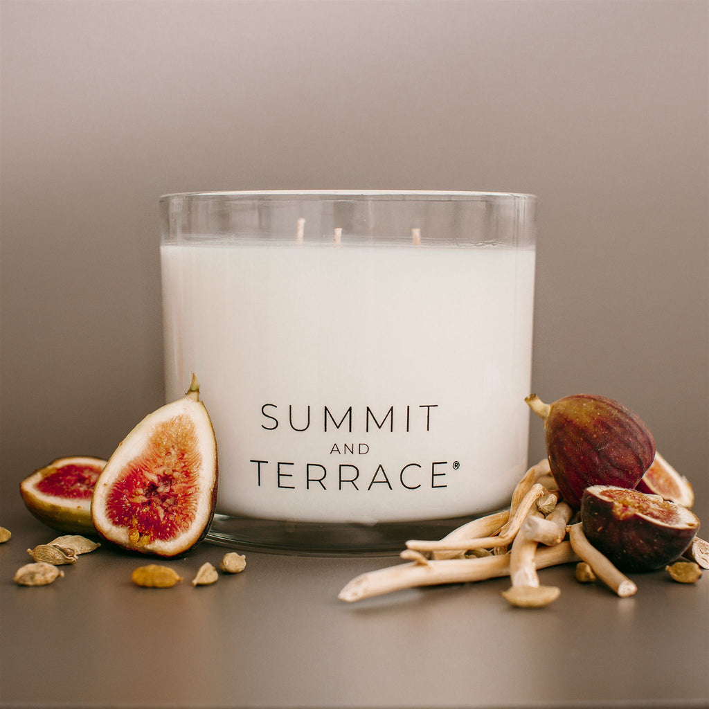 Luisa Terra Muse Grande Candle with three wicks in glass vessel, featuring notes of cedarwood, jasmine, and fig—styled for large, open rooms.

