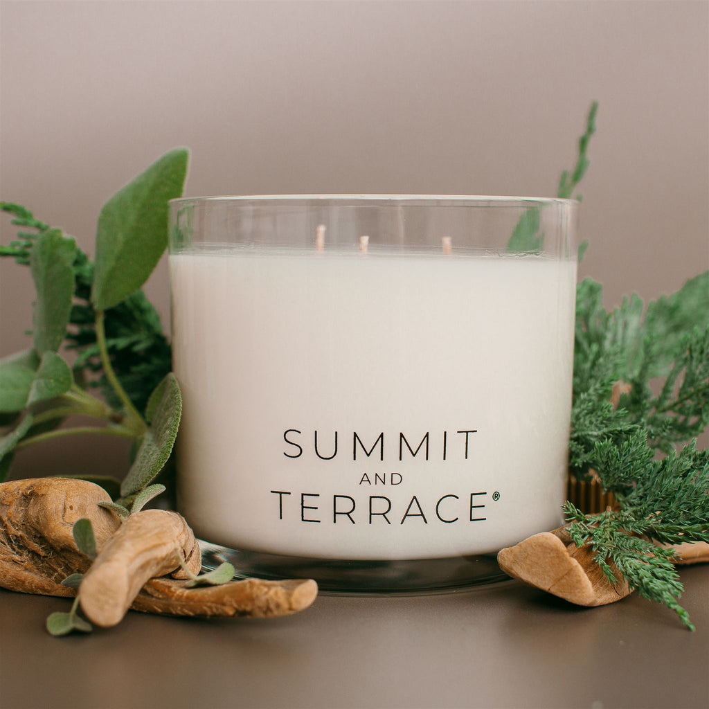 Margaux Muse Grande Candle with three wicks in glass vessel—featuring bergamot, coastal greens, and driftwood for large rooms and relaxed gifting.
